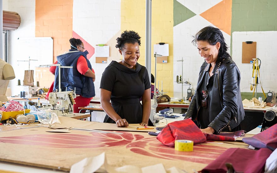 happy-woman-at-work-having-a-conversation